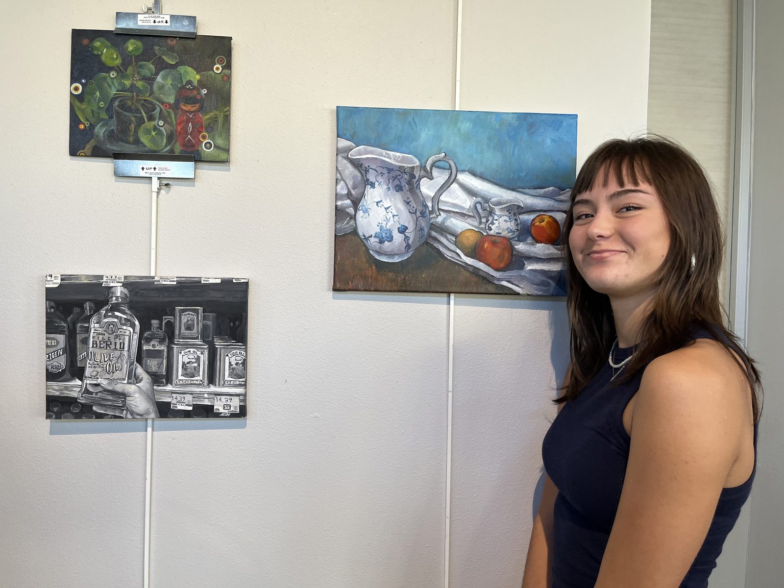 Ada Voight beside her Ursa Major painting.